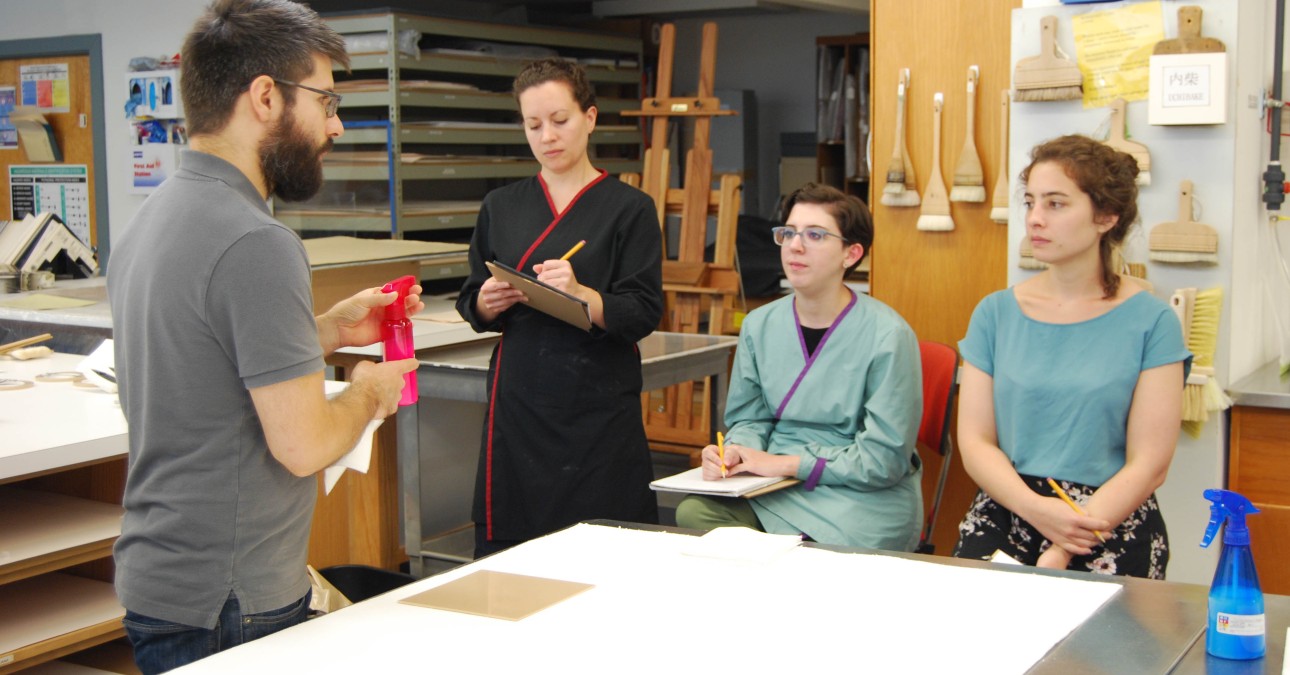 Staff member instructs fellows