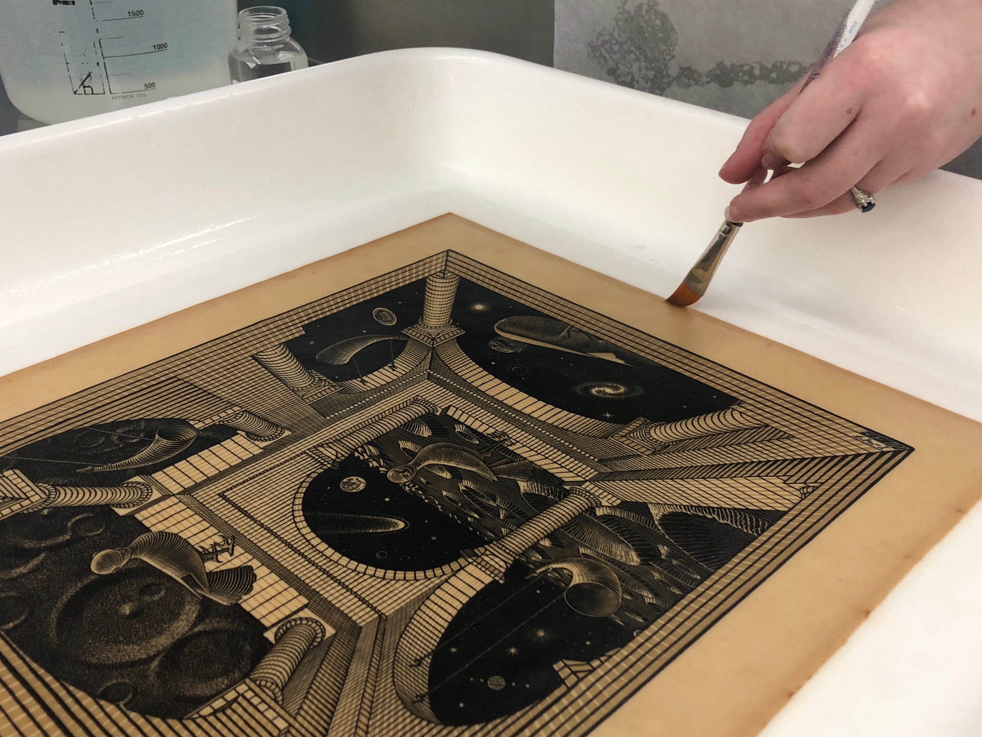 CCAHA Paper Conservator Chloe Houseman recently treated this 1947 print by M.C. Escher, who passed away 50 years ago this month. The piece, Another World II, expanded on Escher's Another World (Other World Gallery) from the previous year.